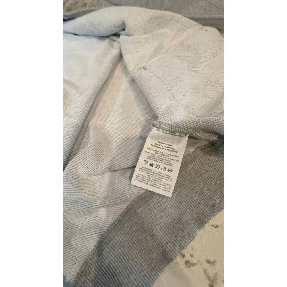 Kids size MEDIUM NIKE oversized fit gray zip up hooded jacket.